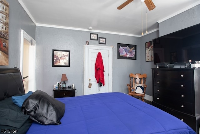 bedroom featuring ceiling fan and crown molding