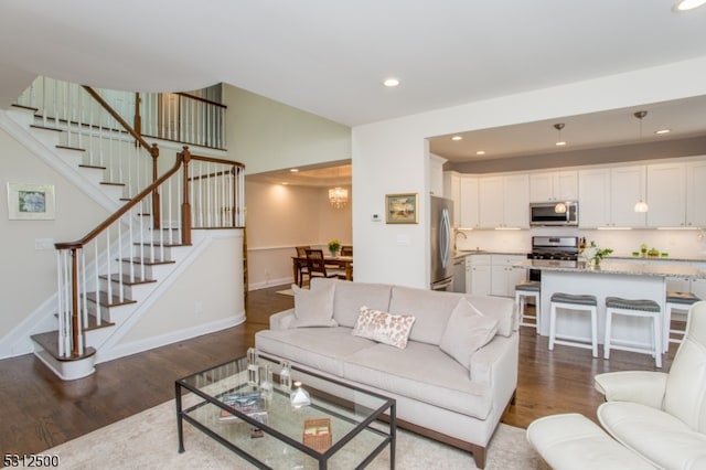 living room with dark wood-type flooring