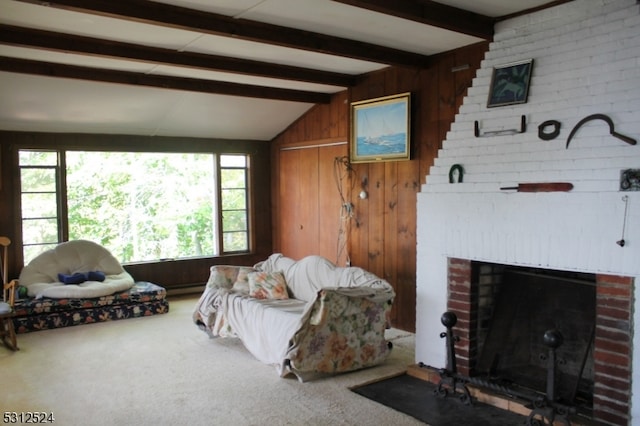 carpeted living room featuring vaulted ceiling with beams, wood walls, and a fireplace