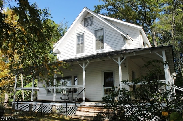 country-style home with covered porch