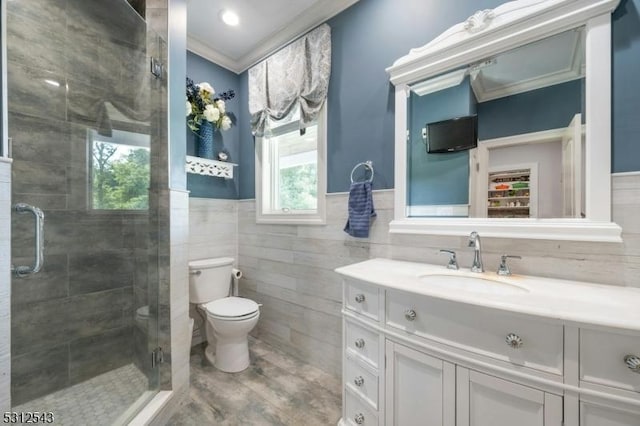 189 Park Rd, Parsippany-Troy Hills Twp, NJ 07054 - bathroom with tile walls, a stall shower, vanity, crown molding, and a wainscoted wall