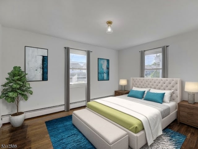 bedroom with dark hardwood / wood-style floors, baseboard heating, and multiple windows