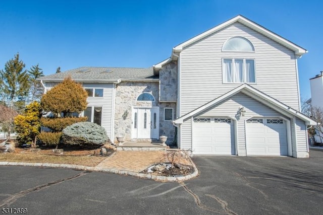 front facade with a garage