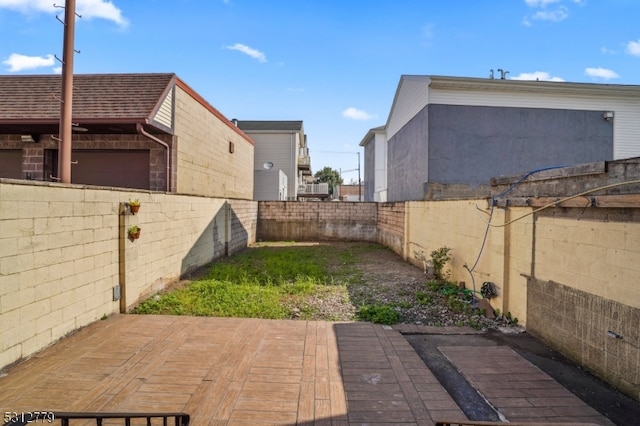 view of yard with a wooden deck