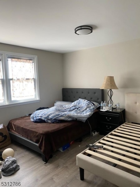 bedroom with light wood-type flooring