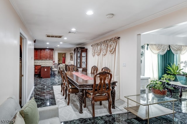 dining space featuring ornamental molding