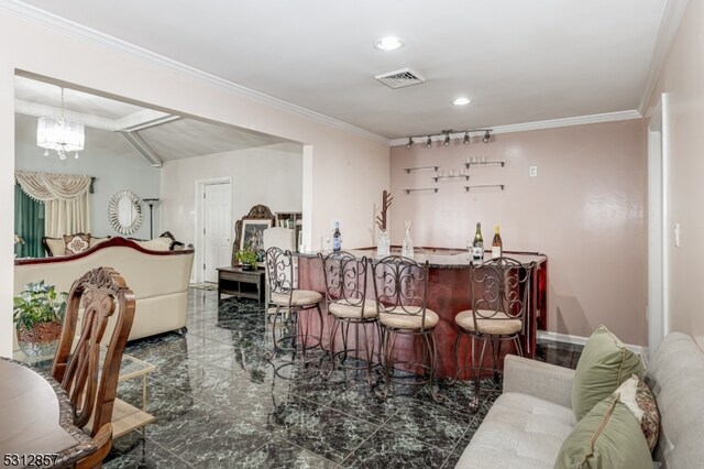 bar featuring an inviting chandelier, lofted ceiling, and crown molding