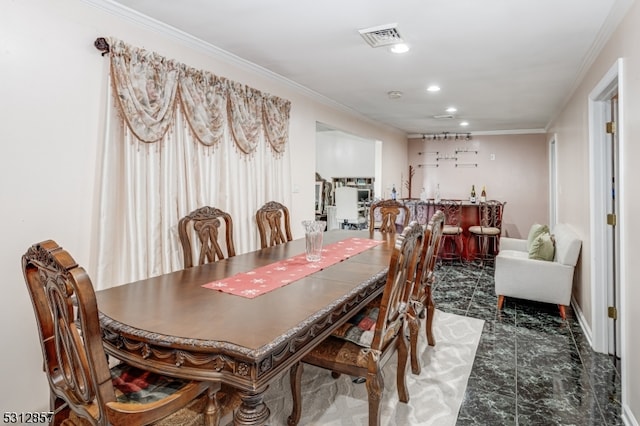 dining room with ornamental molding