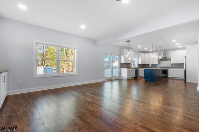 unfurnished living room featuring dark wood-type flooring