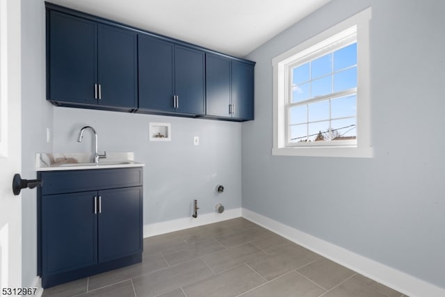 washroom with hookup for a gas dryer, cabinets, sink, and hookup for a washing machine