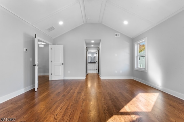 interior space with dark hardwood / wood-style flooring and vaulted ceiling