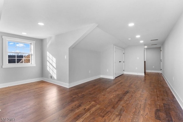 bonus room featuring dark hardwood / wood-style flooring