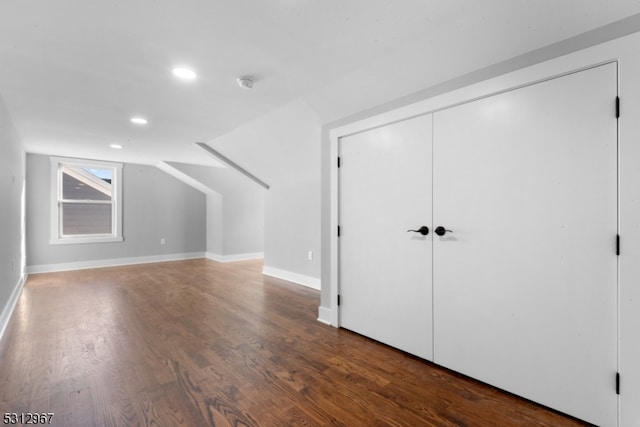 additional living space with dark hardwood / wood-style floors