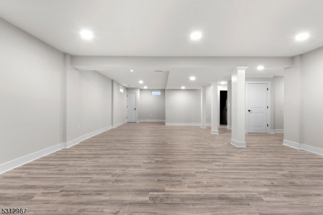 basement featuring light hardwood / wood-style floors