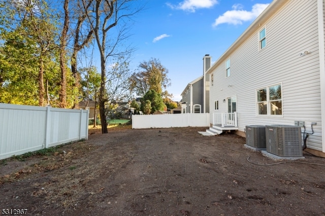 view of yard with central AC unit