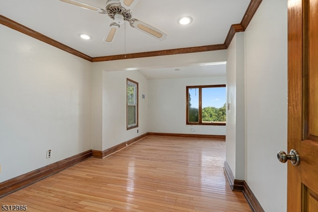 empty room with crown molding, light hardwood / wood-style flooring, and ceiling fan