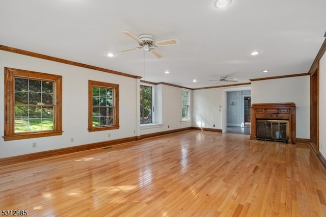 unfurnished living room with ceiling fan, crown molding, and light hardwood / wood-style flooring