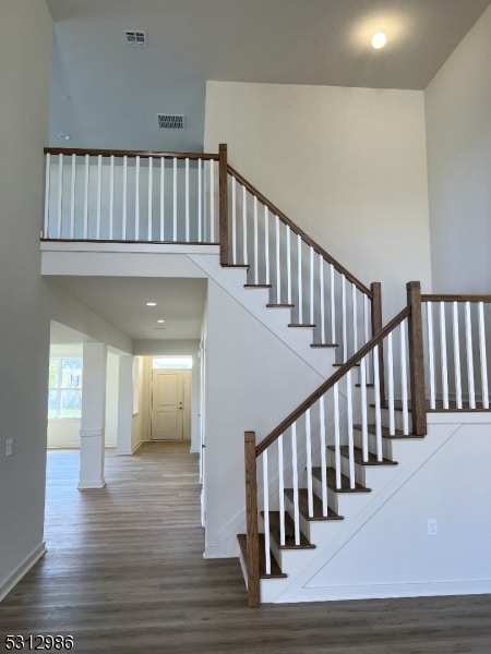 staircase featuring hardwood / wood-style floors