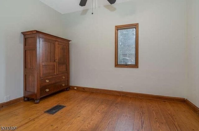 unfurnished bedroom featuring ceiling fan and wood-type flooring