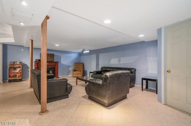 living room featuring a fireplace