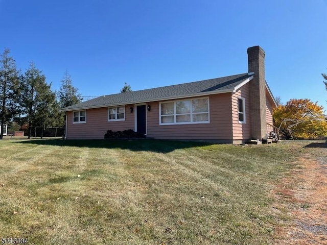 ranch-style house with a front lawn