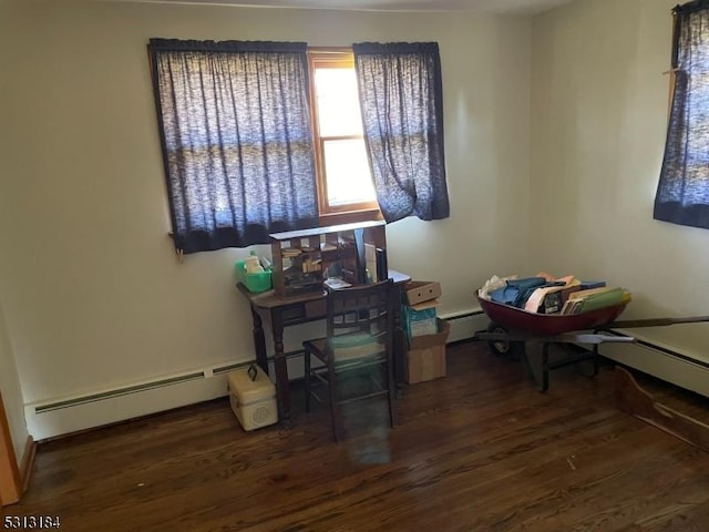 misc room featuring dark wood-type flooring and baseboard heating