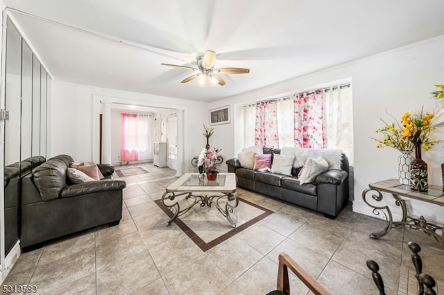 tiled living room featuring ceiling fan