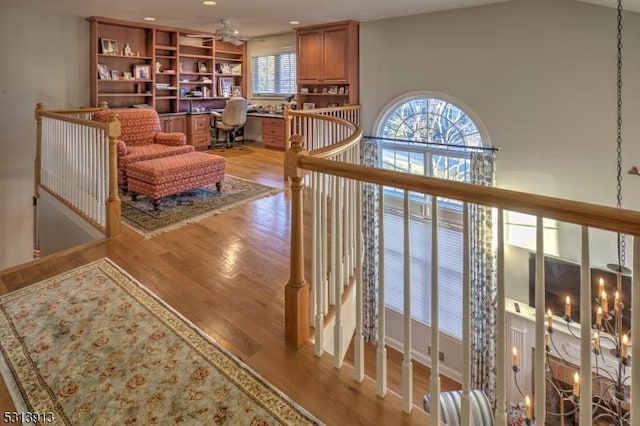 corridor with light hardwood / wood-style flooring