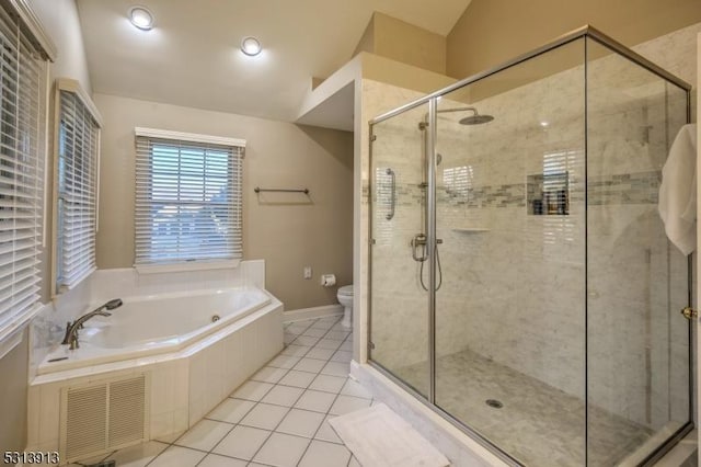 bathroom featuring independent shower and bath, toilet, and tile patterned floors