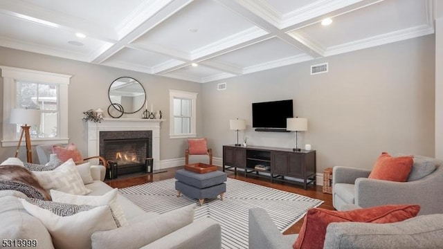 living room with coffered ceiling, beamed ceiling, and dark hardwood / wood-style flooring