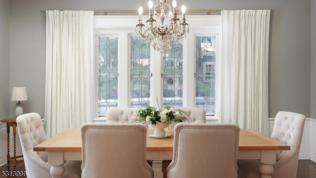 dining area featuring an inviting chandelier