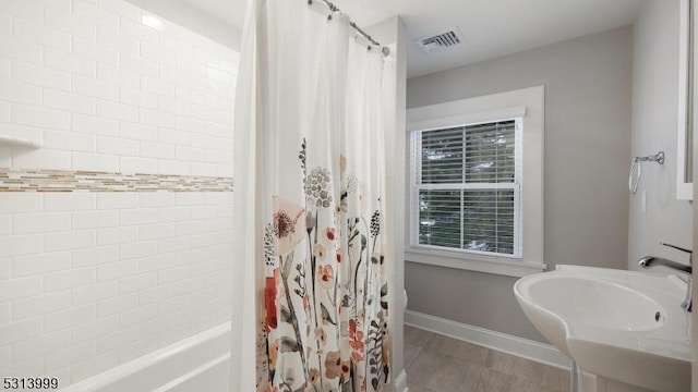 bathroom featuring sink and shower / tub combo