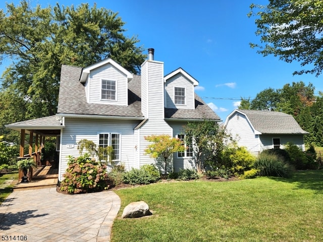 cape cod-style house with a front lawn