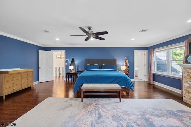 bedroom with ornamental molding, ceiling fan, and dark wood-type flooring