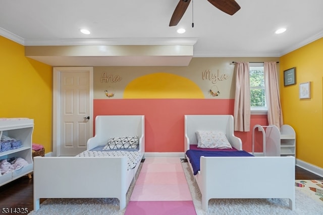 bedroom featuring ceiling fan, hardwood / wood-style flooring, and ornamental molding