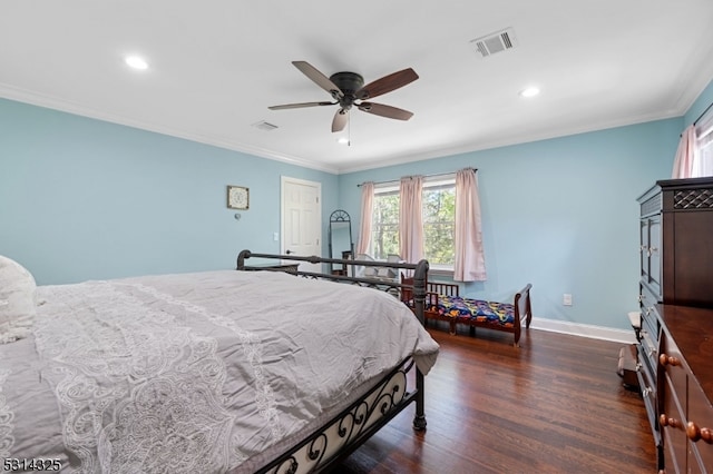 bedroom featuring ceiling fan, ornamental molding, and dark hardwood / wood-style flooring