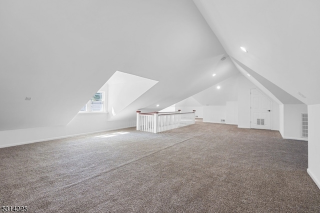 bonus room featuring lofted ceiling and carpet