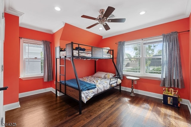 bedroom with ceiling fan, dark hardwood / wood-style floors, and crown molding