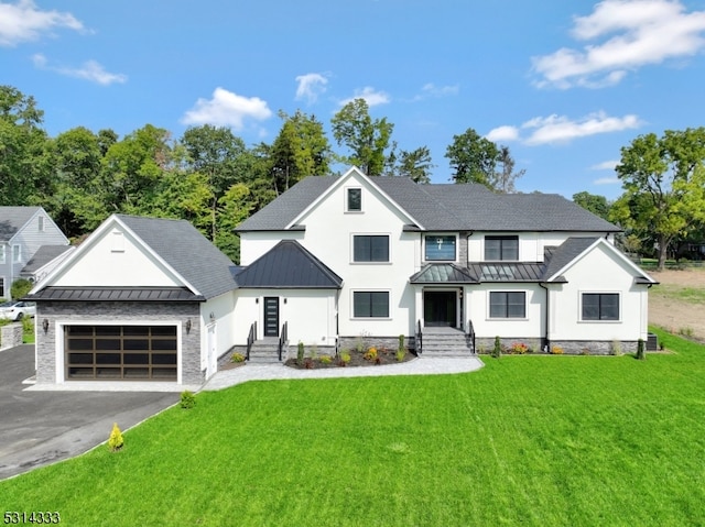 modern farmhouse style home with a garage and a front yard