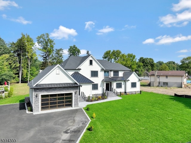 view of front facade featuring a garage and a front lawn