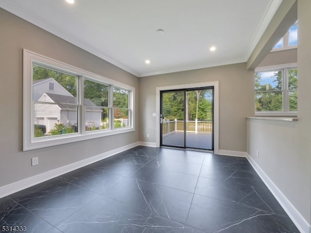 unfurnished room with crown molding