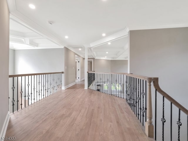 corridor with beam ceiling, light hardwood / wood-style floors, and crown molding