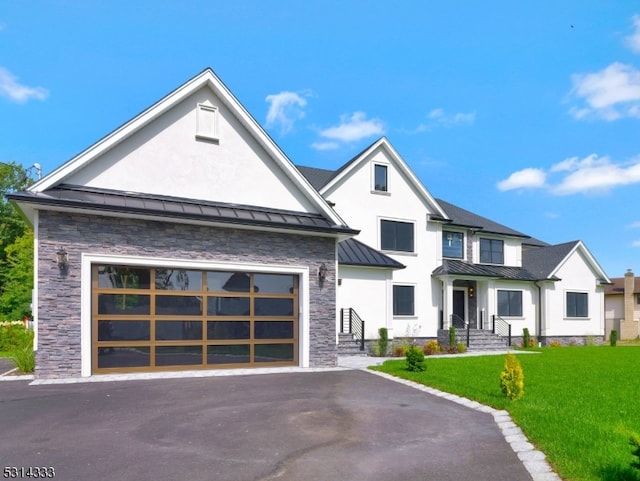 view of front facade with a garage and a front lawn