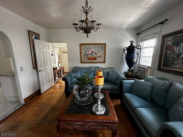 living room featuring cooling unit and an inviting chandelier