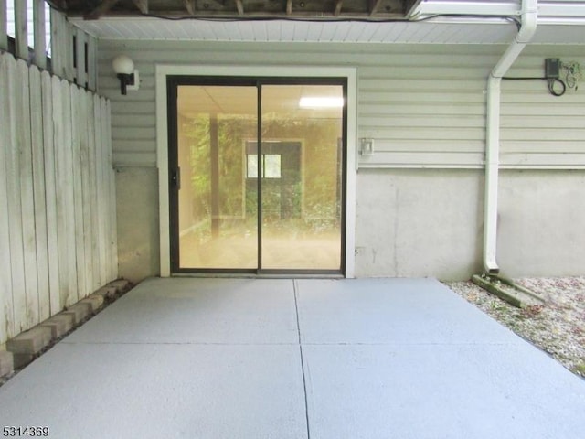 property entrance with a patio