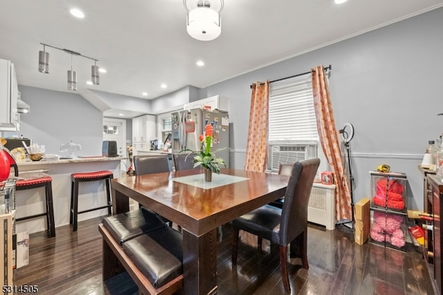 dining room featuring cooling unit and dark wood-type flooring