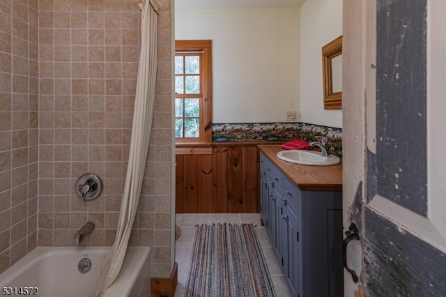 bathroom featuring vanity, shower / bath combo, and tile patterned floors