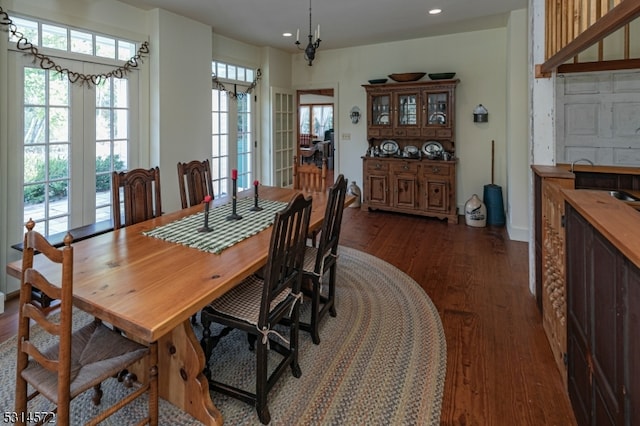 dining area with dark hardwood / wood-style flooring