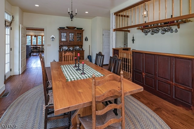 dining area with dark wood-type flooring