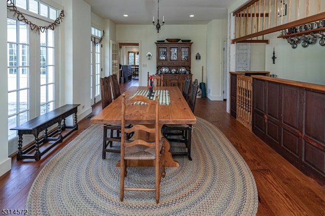 dining room with french doors and dark hardwood / wood-style flooring